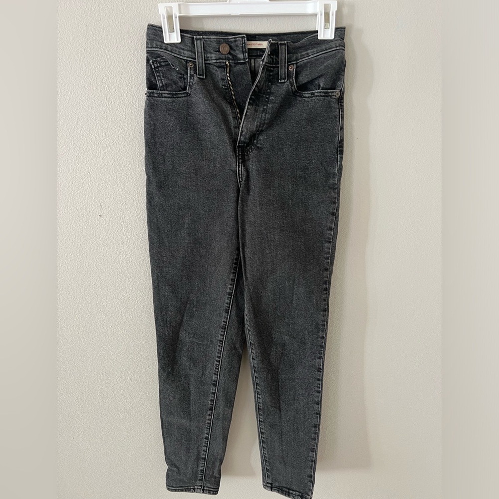 Levi’s size 24 high-waisted tapered black denim jeans. super comfortable & cute!